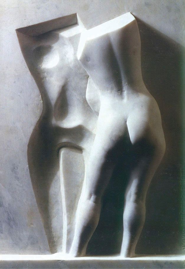 Marble relief “A woman in front of the mirror”: a white female torso in the foreground beside a shallow, hollowed-out reflection of the figure, lit from one side.