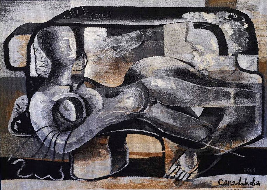 Tapestry “Awakening in a Dolmen”: a grey-toned reclining female figure and a head inside a dark rounded frame, with browns and blacks around it.