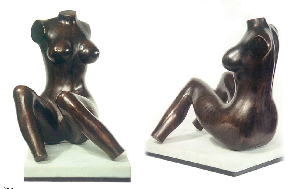 Bronze sculpture “Luda”: a headless female torso seated with legs apart and one arm raised, dark brown, on a white marble base, shown from two angles.