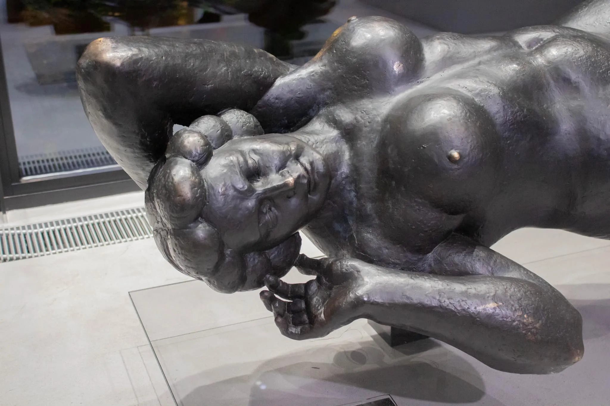 Close view of Margo’s face, raised arm and hand