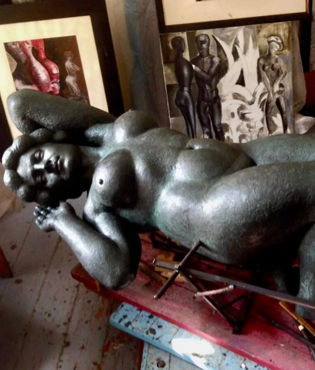 Margo in plasticine: the figure lying on her side, head resting on her hand, in the studio